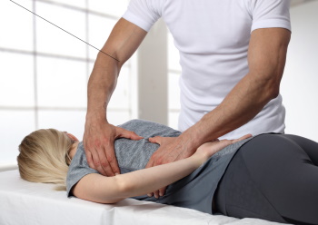 Woman having chiropractic back - Vital Family Chiropractic- Sciatica - Mount Pleasant, SC